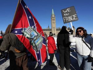 Dave Chan via Getty Images, February, 2022. Canadian "Freedom Convoy" truckers look suspiciously like American QAnon and Trump supporters, despite the differences in government history and leadership. This was demonstrated heavily during the "Freedom Convoy" at the border of the US and Canada in 2022.