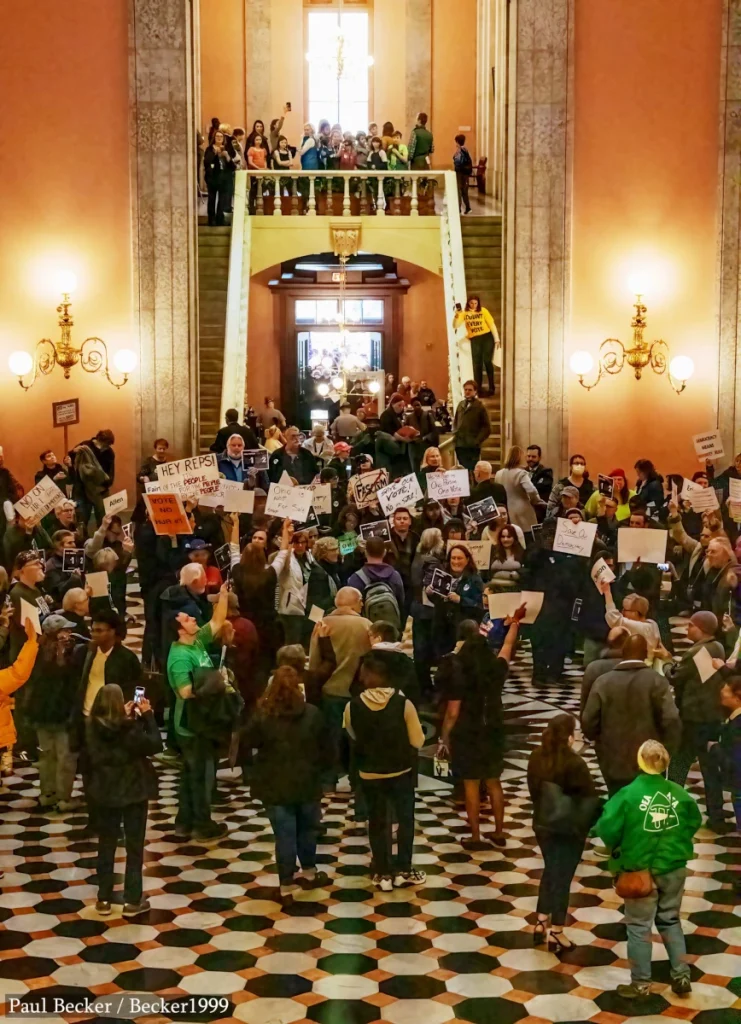 Image of the rotunda of the Ohio Statehouse. A crowd of people is inside, many with signs. From a Day of Action for Democracy in Columbus, Ohio, May, 3, 2023. Photo courtesy Paul Becker.